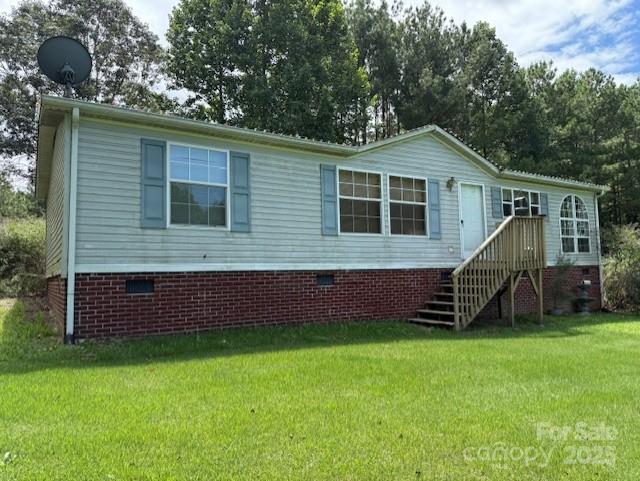 1017 Warlick Road Lawndale, NC 28090 - Photo 39 of 39 a front view of a house with a yard