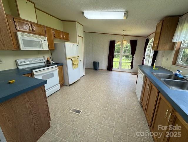 1017 Warlick Road Lawndale, NC 28090 - Photo 4 of 39 a kitchen with refrigerator a stove a sink dishwasher and wooden cabinets