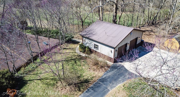 2066 Tolbert Road Hamilton, OH 45011 - Photo 59 of 63 An aerial view showcases a garage and surrounding landscape.