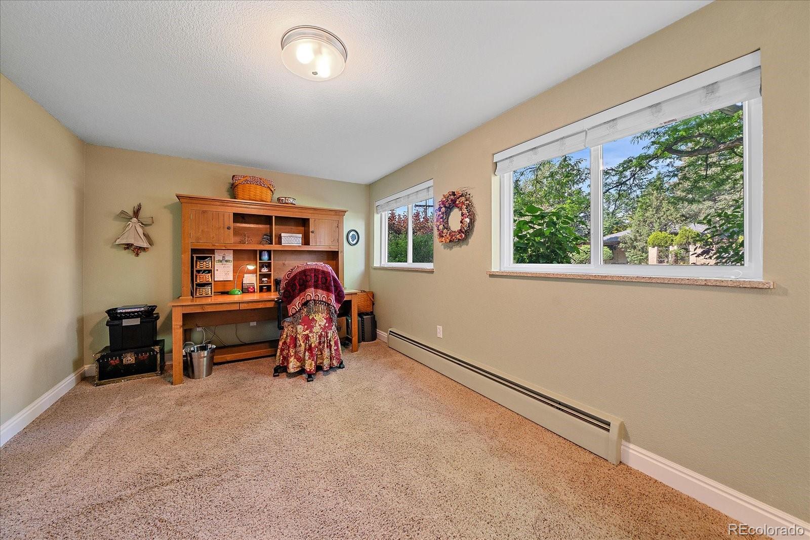 930 Reed Court Lakewood, CO 80214 - Photo 23 of 41 a view of livingroom with furniture and a window