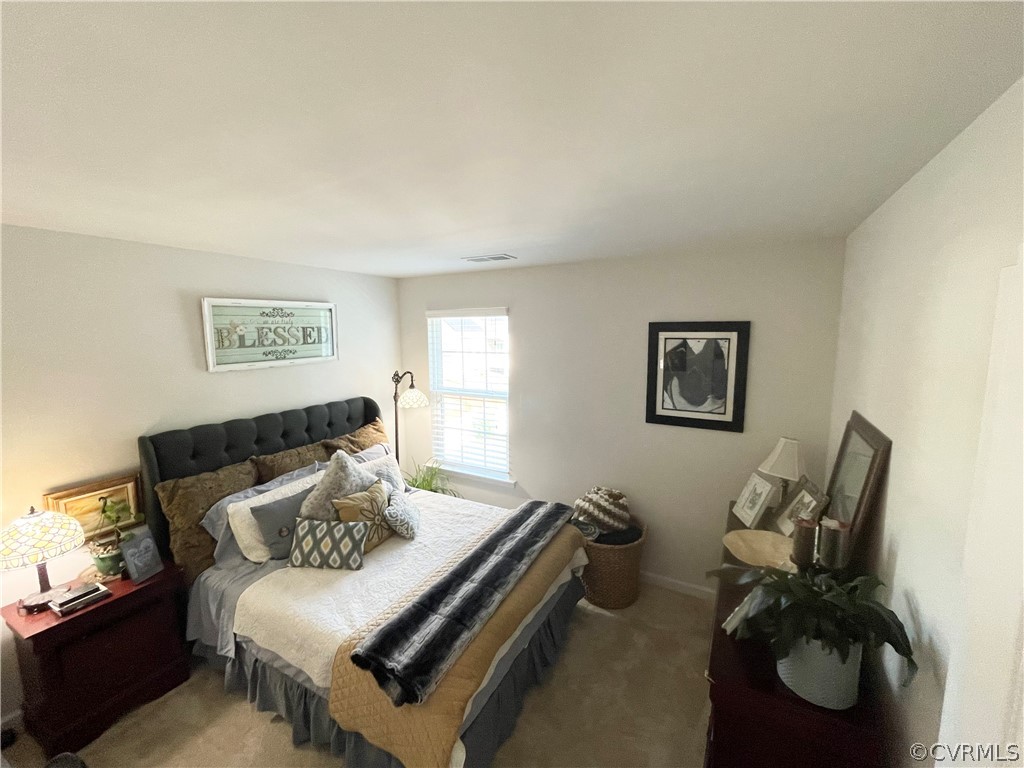 10219 Sandy Ridge Drive Chesterfield, VA 23832 - Photo 16 of 28 a bedroom with bed and a window