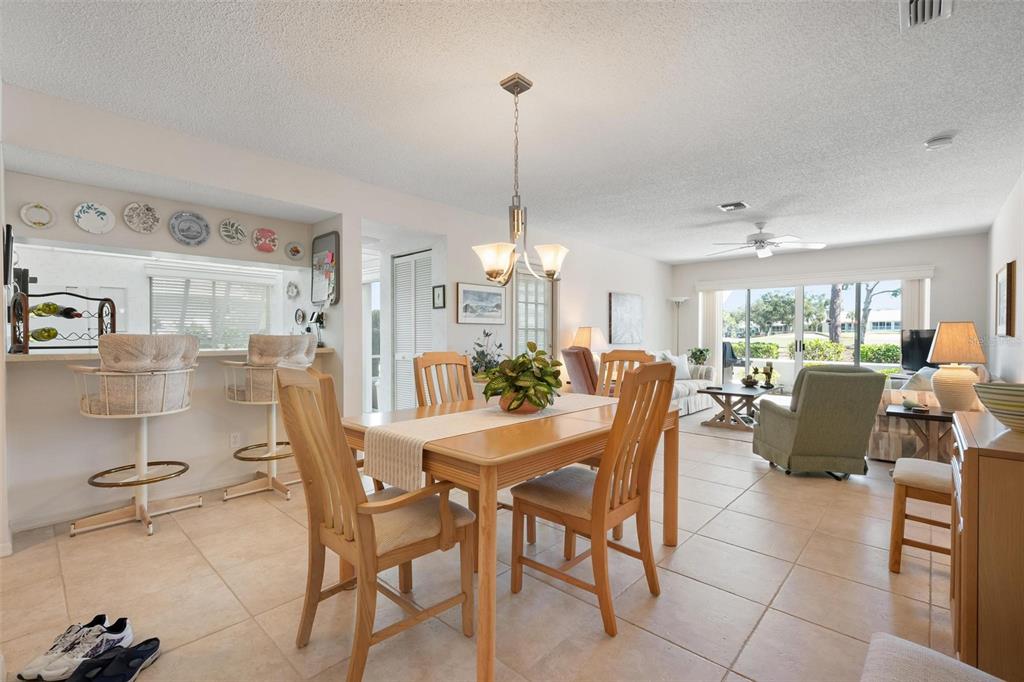 270 Cerromar Way South, Unit 57 Venice, FL 34293 - Photo 11 of 81 a dining room with furniture and window