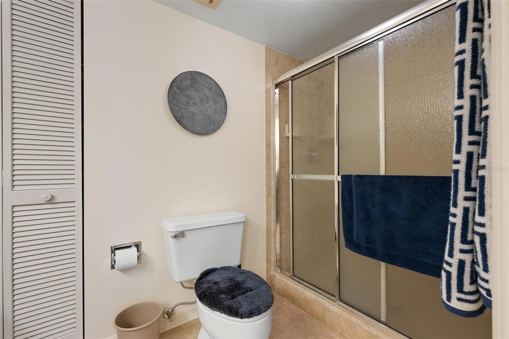 270 Cerromar Way South, Unit 57 Venice, FL 34293 - Photo 22 of 81 a bathroom with a shower and a mirror