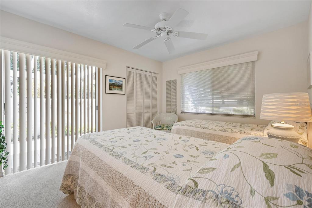 270 Cerromar Way South, Unit 57 Venice, FL 34293 - Photo 23 of 81 a bedroom with a large bed and a window