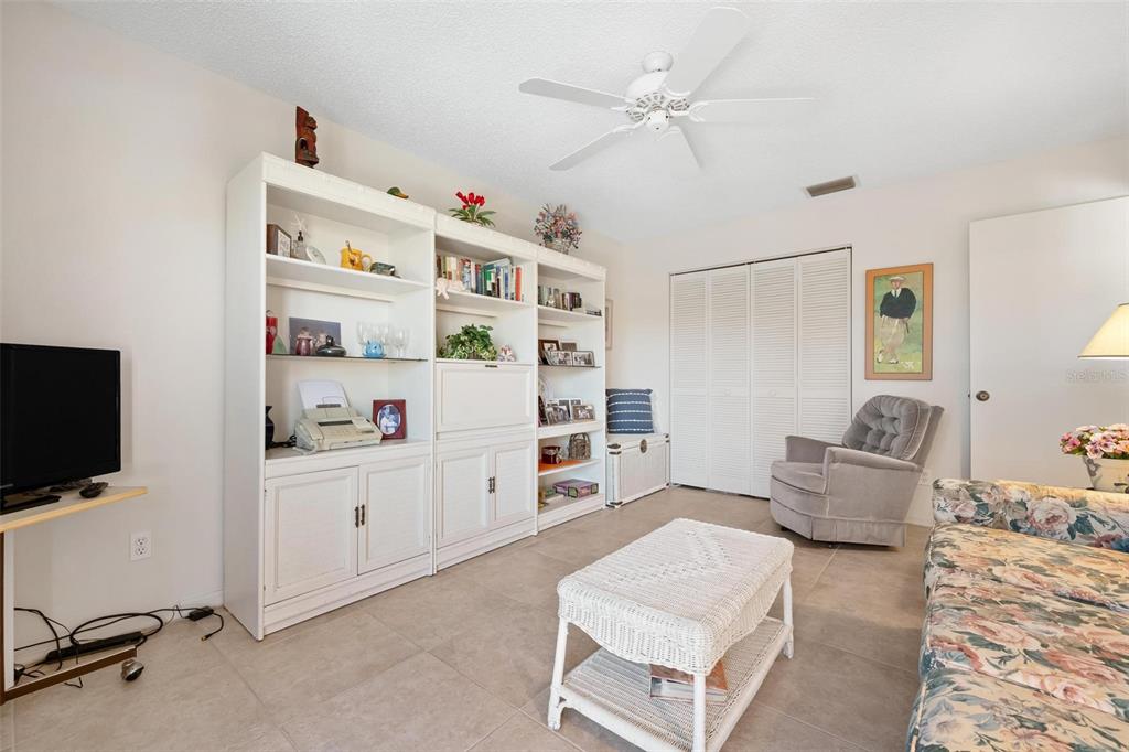 270 Cerromar Way South, Unit 57 Venice, FL 34293 - Photo 28 of 81 a living room with furniture and flat screen tv
