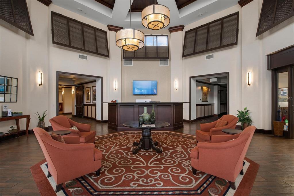 270 Cerromar Way South, Unit 57 Venice, FL 34293 - Photo 62 of 81 a living room with furniture a fireplace and a flat screen tv