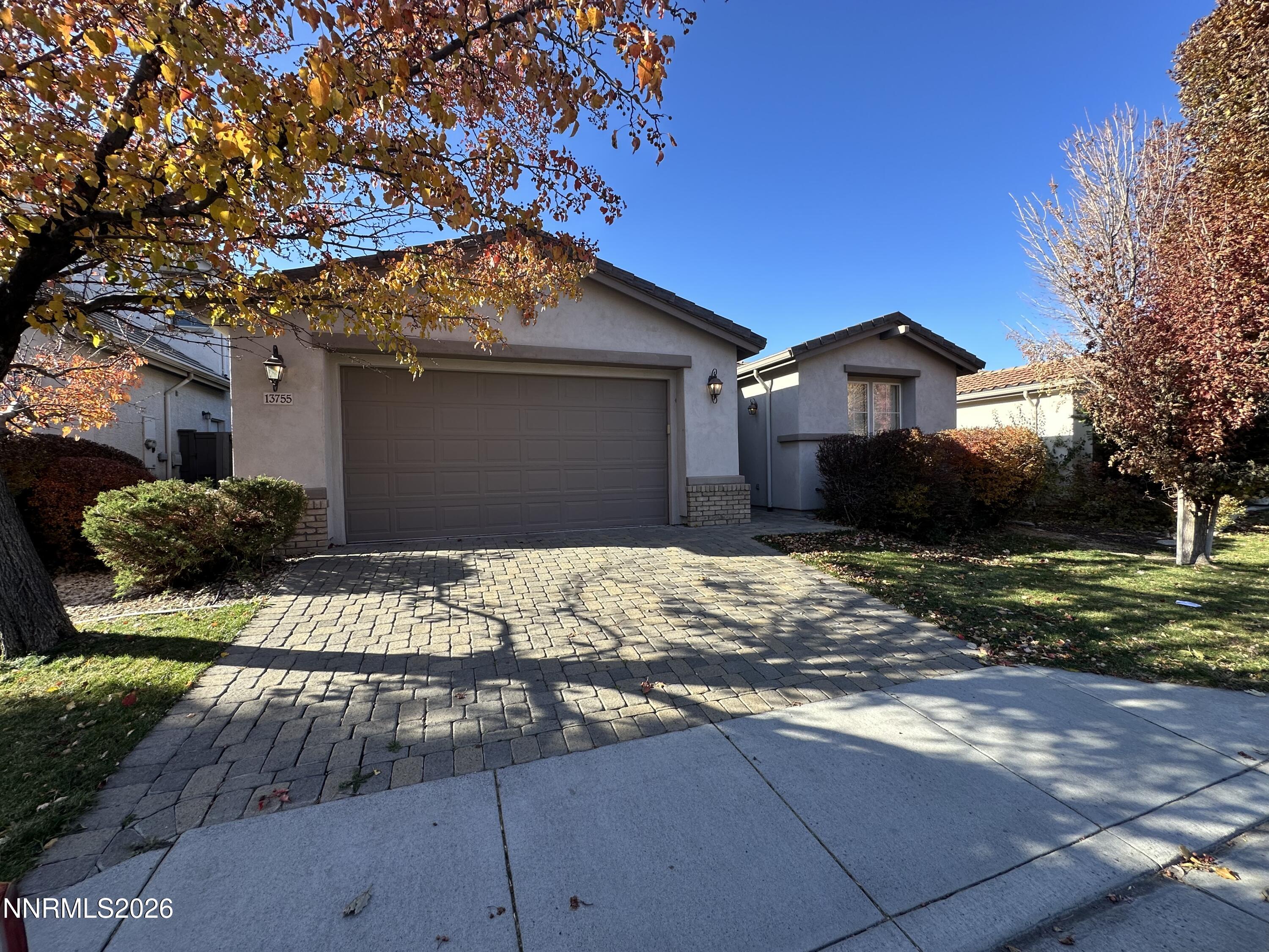 13755 Seabiscuit Drive Reno, NV 89521 - Photo 1 of 19 a front view of a house with a yard
