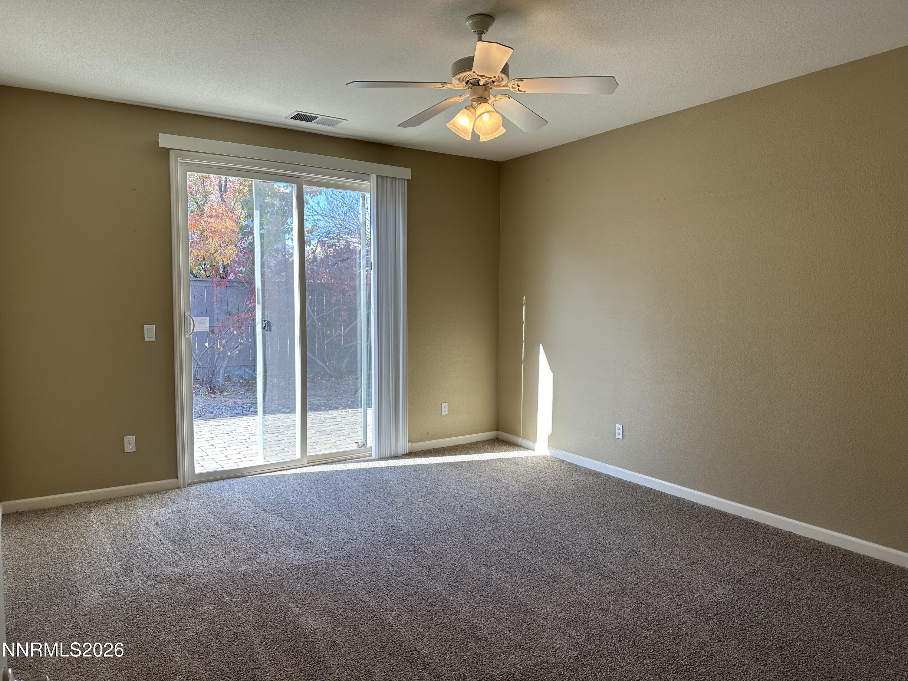 13755 Seabiscuit Drive Reno, NV 89521 - Photo 13 of 19 a view of an empty room with a window
