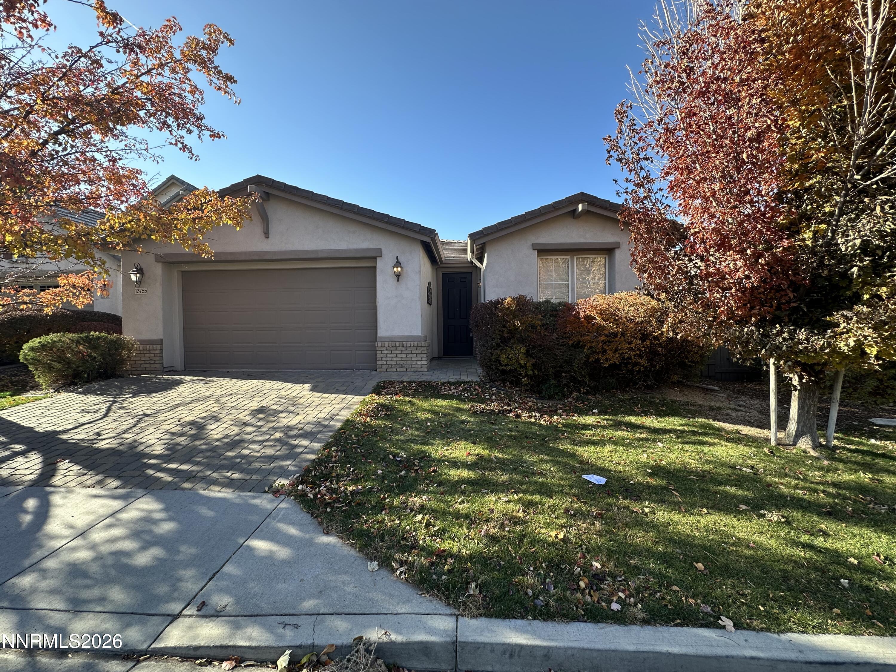 13755 Seabiscuit Drive Reno, NV 89521 - Photo 3 of 19 a front view of a house with a yard