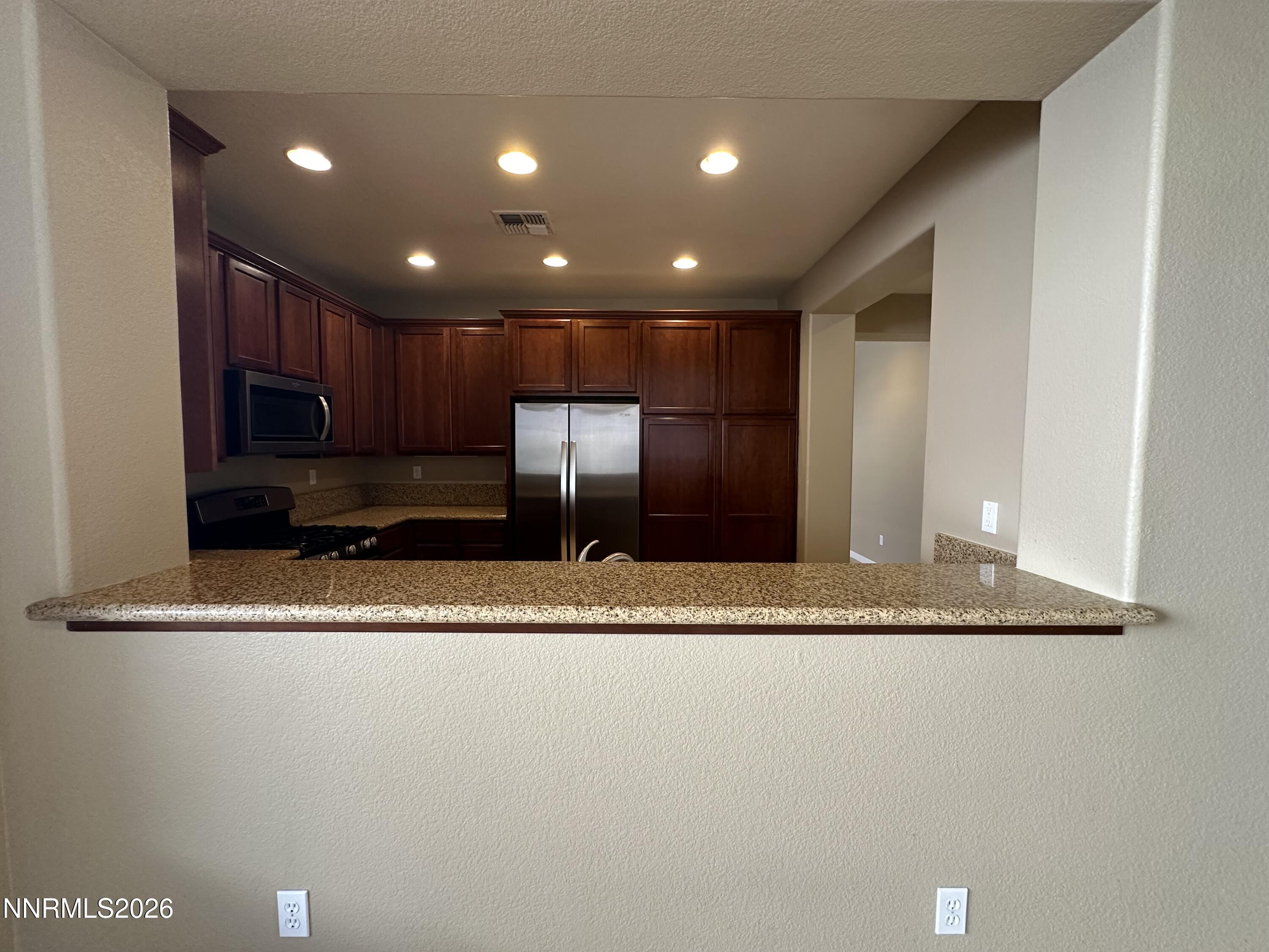 13755 Seabiscuit Drive Reno, NV 89521 - Photo 7 of 19 a view of a kitchen with a sink and dishwasher