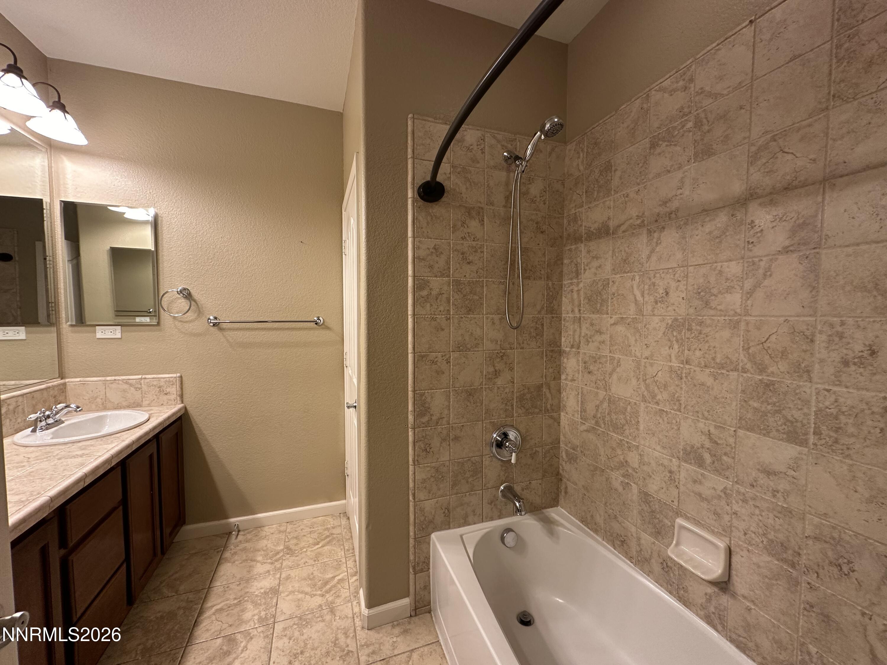 13755 Seabiscuit Drive Reno, NV 89521 - Photo 10 of 19 a bathroom with a sink a toilet and shower