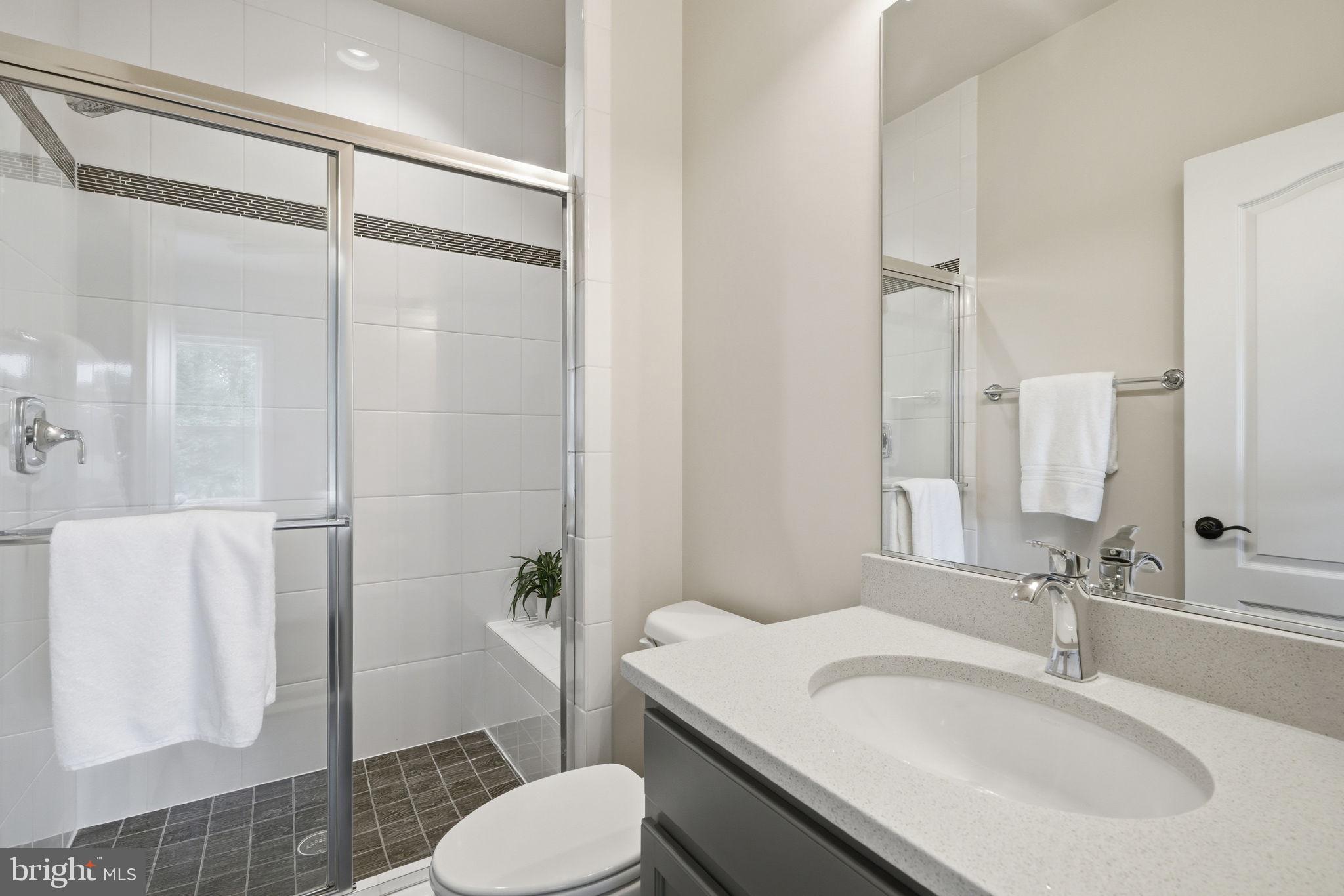 7821 Old Falls Road McLean, VA 22102 - Photo 37 of 62 a bathroom with a sink toilet and shower