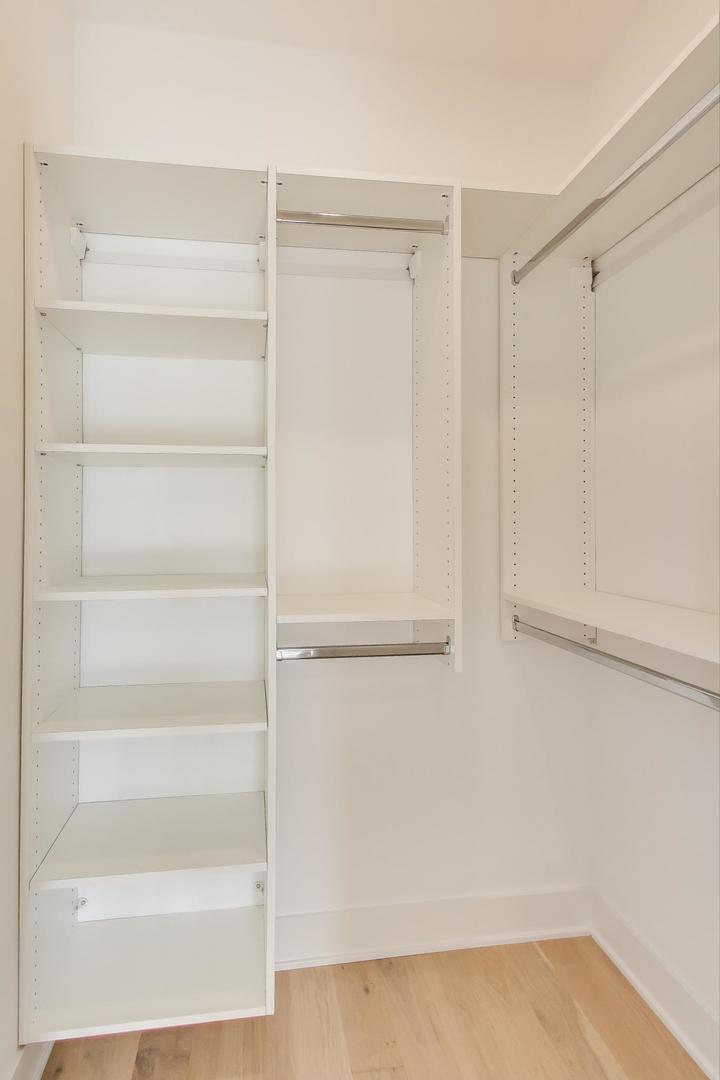 1619 West Lawrence Avenue, Unit 2 Chicago, IL 60640 - Photo 11 of 19 a view of walk in closet with empty racks