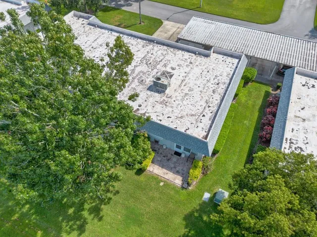 an aerial view of a house with a garden