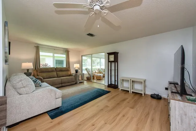 a living room with furniture and a rug