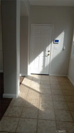 a view of an empty room and window