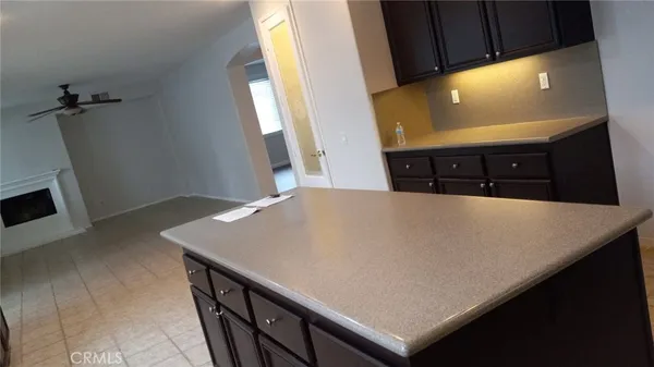 a view of a hallway with furniture