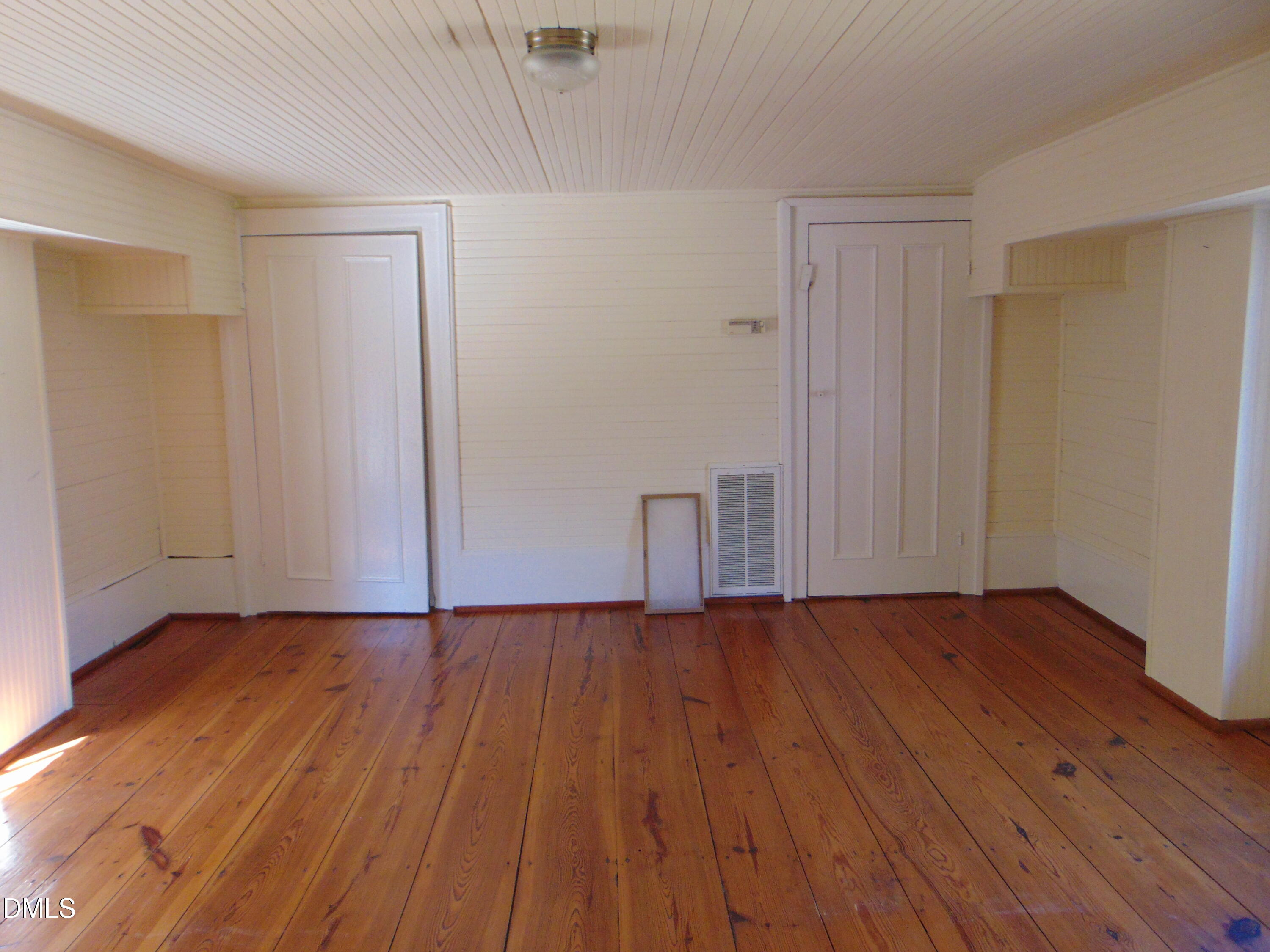 4067 Chewning Road Oxford, NC 27565 - Photo 74 of 82 a view of an empty room with wooden floor