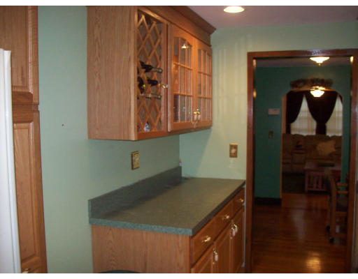 8 Pine Street, Unit 1 Peabody, MA 01960 - Photo 2 of 7 a kitchen with a sink and cabinets