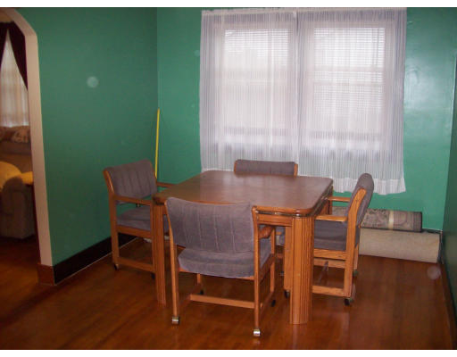 8 Pine Street, Unit 1 Peabody, MA 01960 - Photo 3 of 7 a view of a dining room with furniture and wooden floor