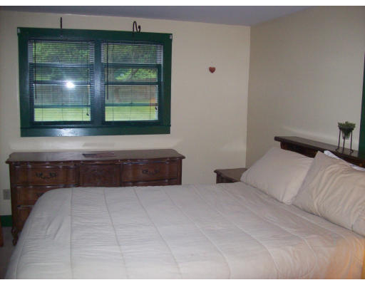 8 Pine Street, Unit 1 Peabody, MA 01960 - Photo 6 of 7 a bedroom with a bed and window