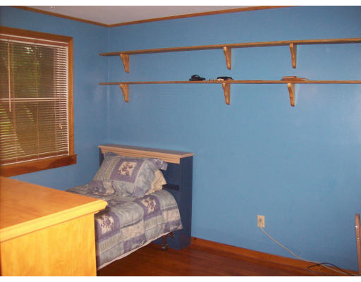 8 Pine Street, Unit 1 Peabody, MA 01960 - Photo 7 of 7 a bed sitting in a bedroom next to a window