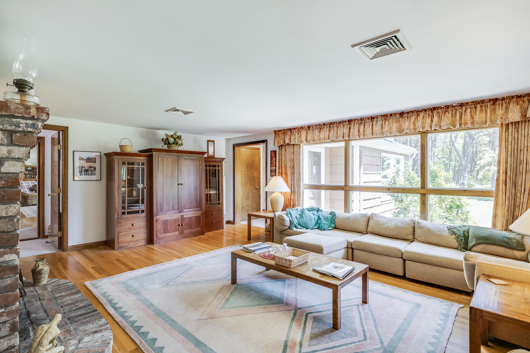 72 South Highland Road Truro, MA 02666 - Photo 12 of 59 a living room with furniture and a large window