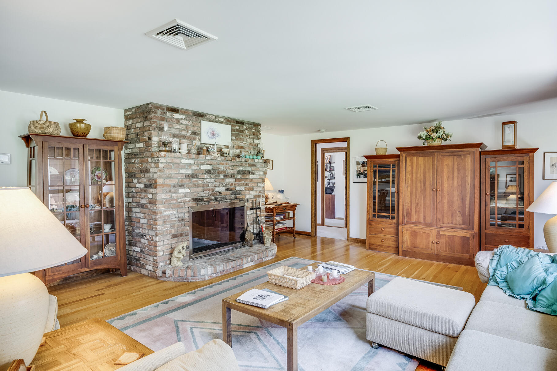 72 South Highland Road Truro, MA 02666 - Photo 13 of 59 a living room with furniture and a fireplace