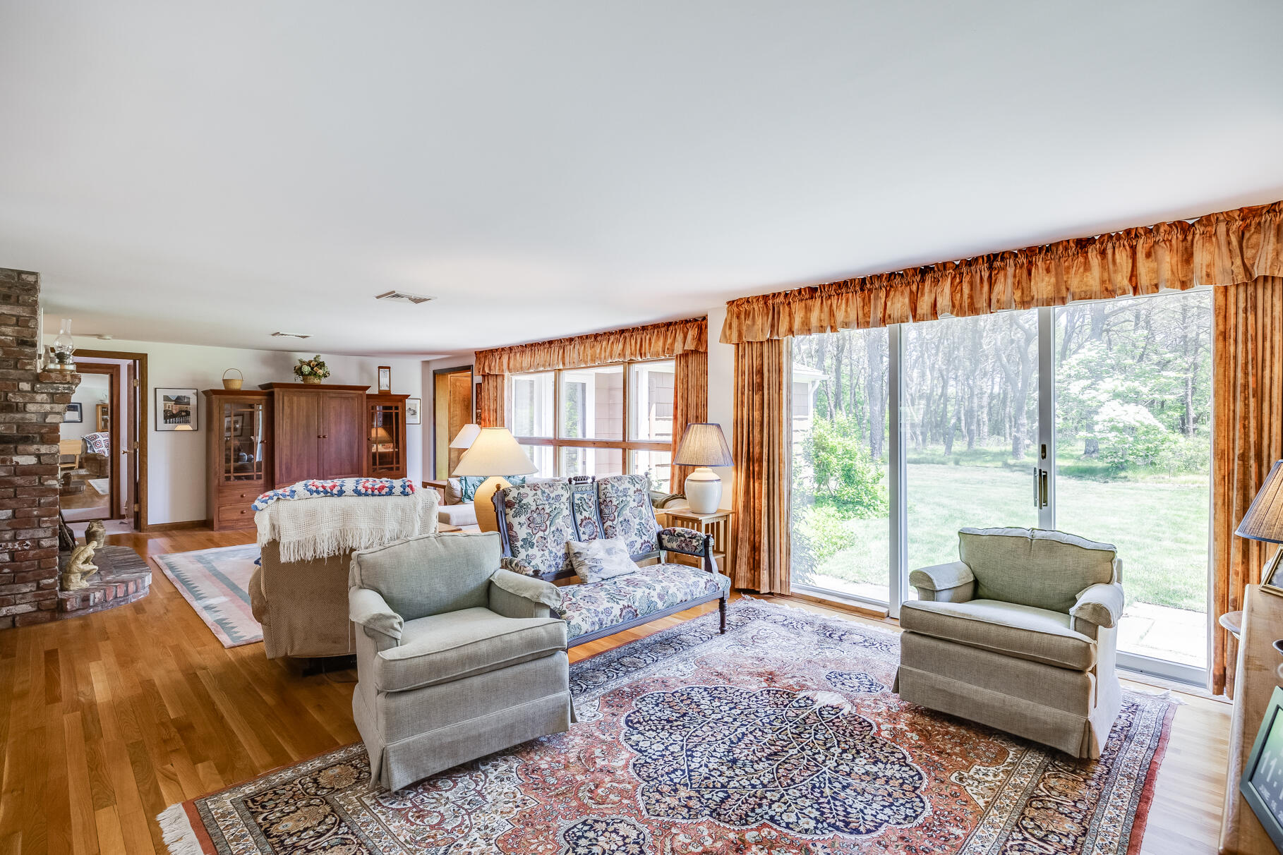 72 South Highland Road Truro, MA 02666 - Photo 16 of 59 a living room with furniture and a large window