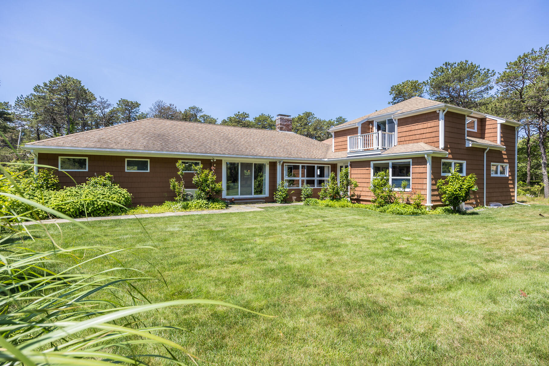 72 South Highland Road Truro, MA 02666 - Photo 2 of 59 a front view of a house with a garden