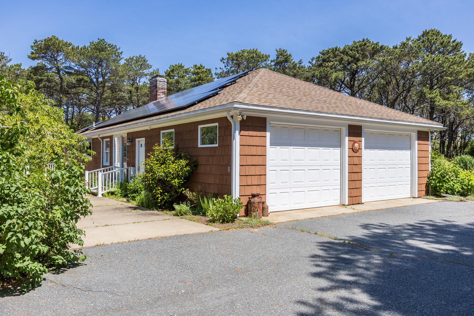 72 South Highland Road Truro, MA 02666 - Photo 37 of 59 a front view of a house with a yard and garage