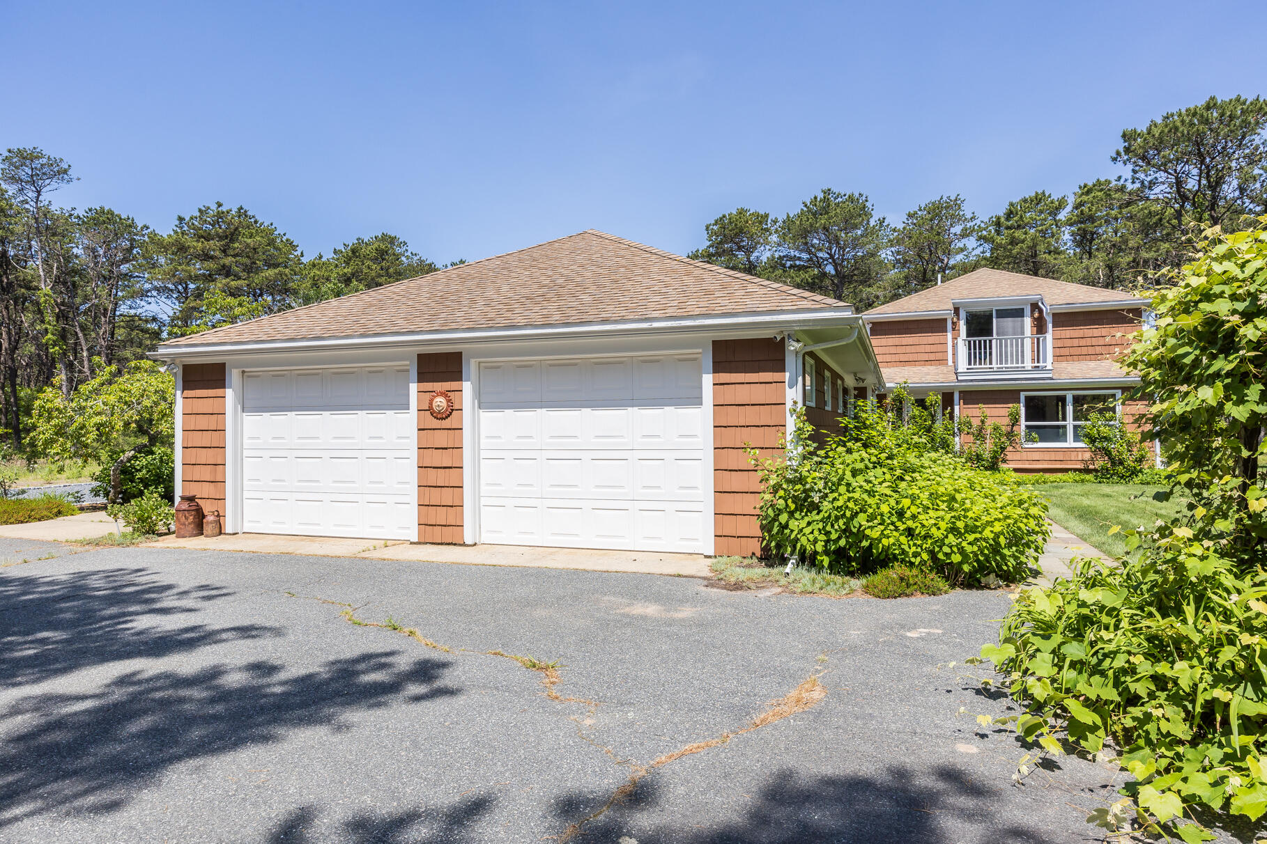 72 South Highland Road Truro, MA 02666 - Photo 39 of 59 a front view of a house with a yard and garage