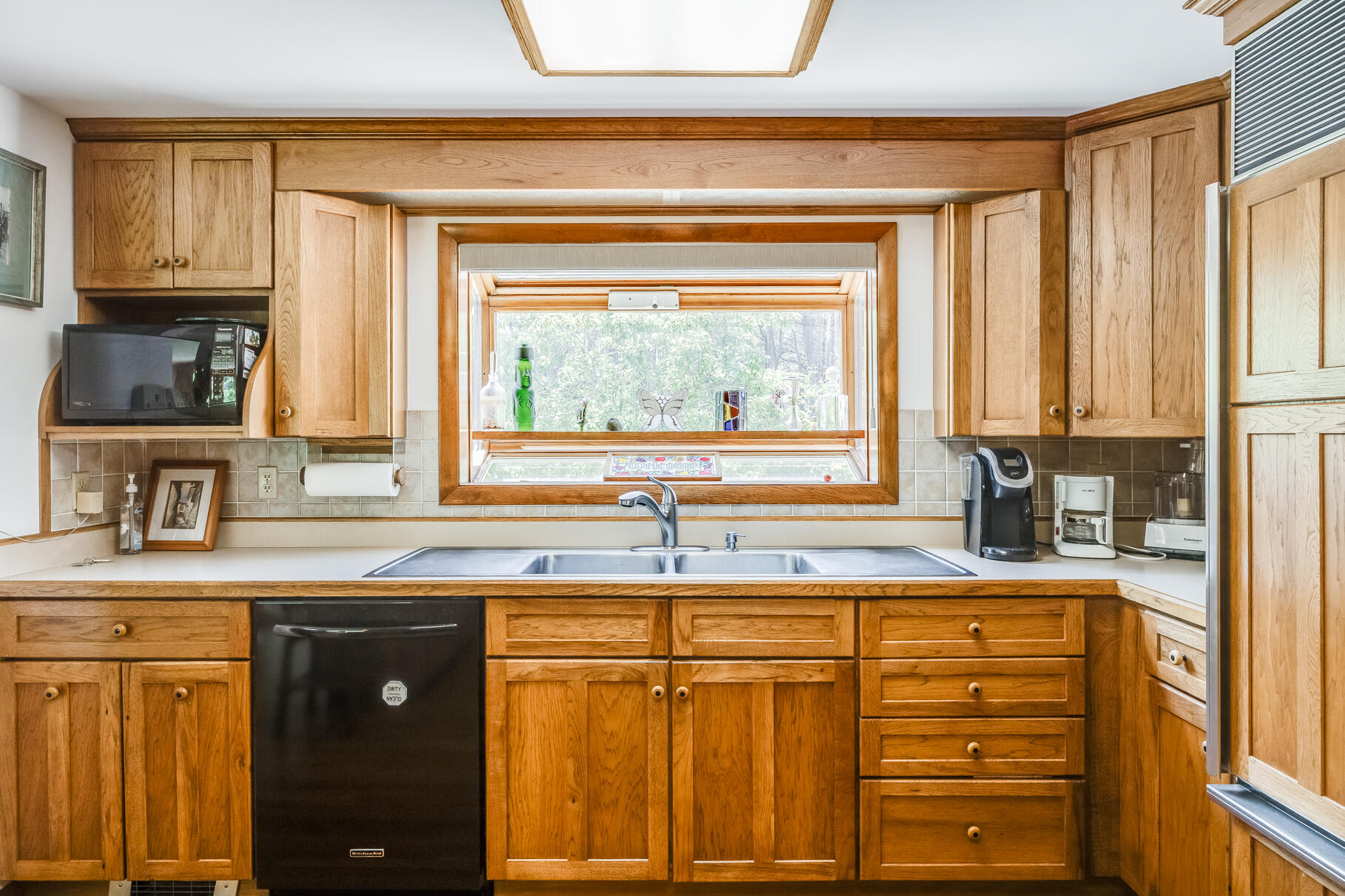 72 South Highland Road Truro, MA 02666 - Photo 6 of 59 a kitchen with granite countertop a sink and a window