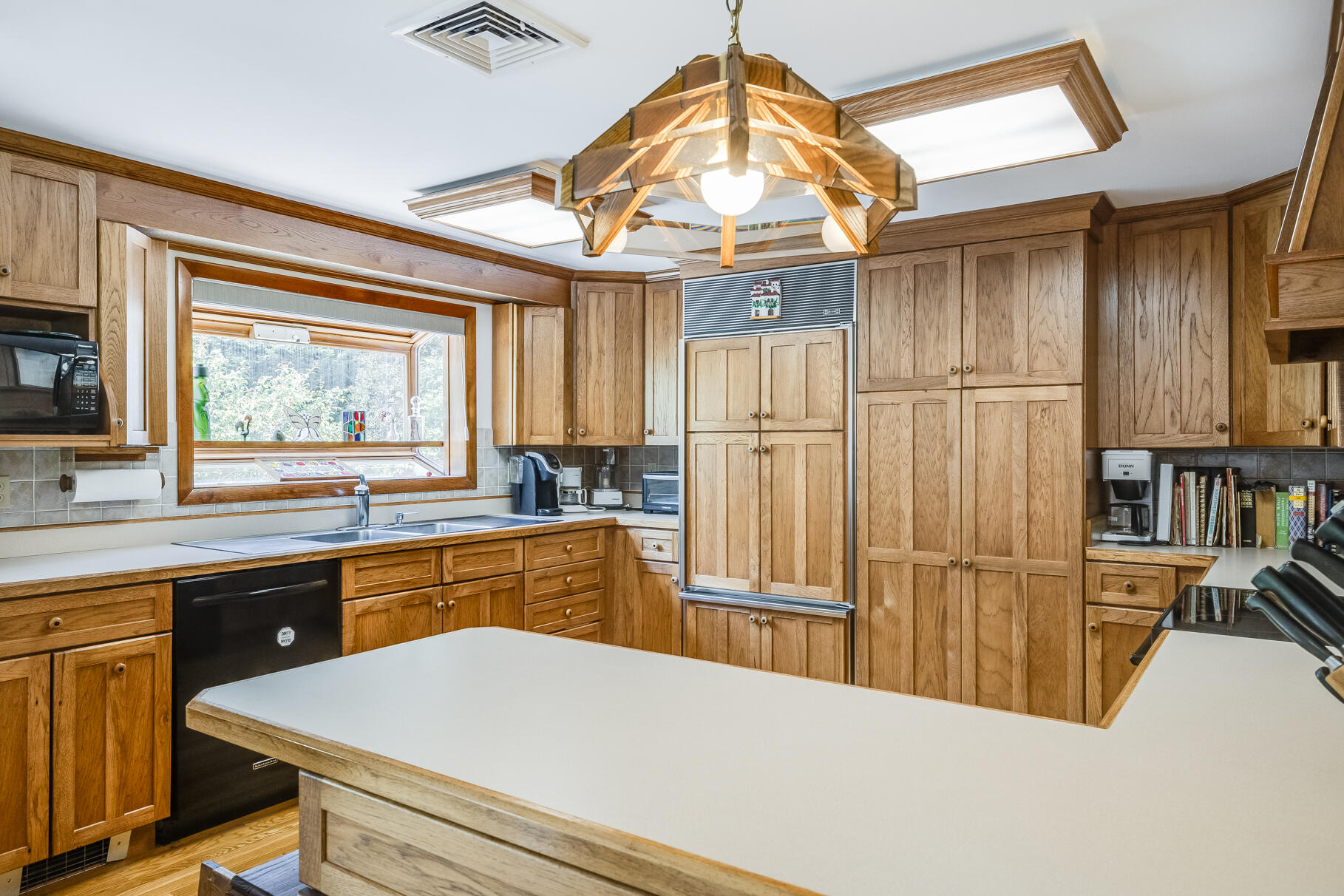 72 South Highland Road Truro, MA 02666 - Photo 7 of 59 a kitchen with stainless steel appliances a stove a refrigerator and wooden cabinets