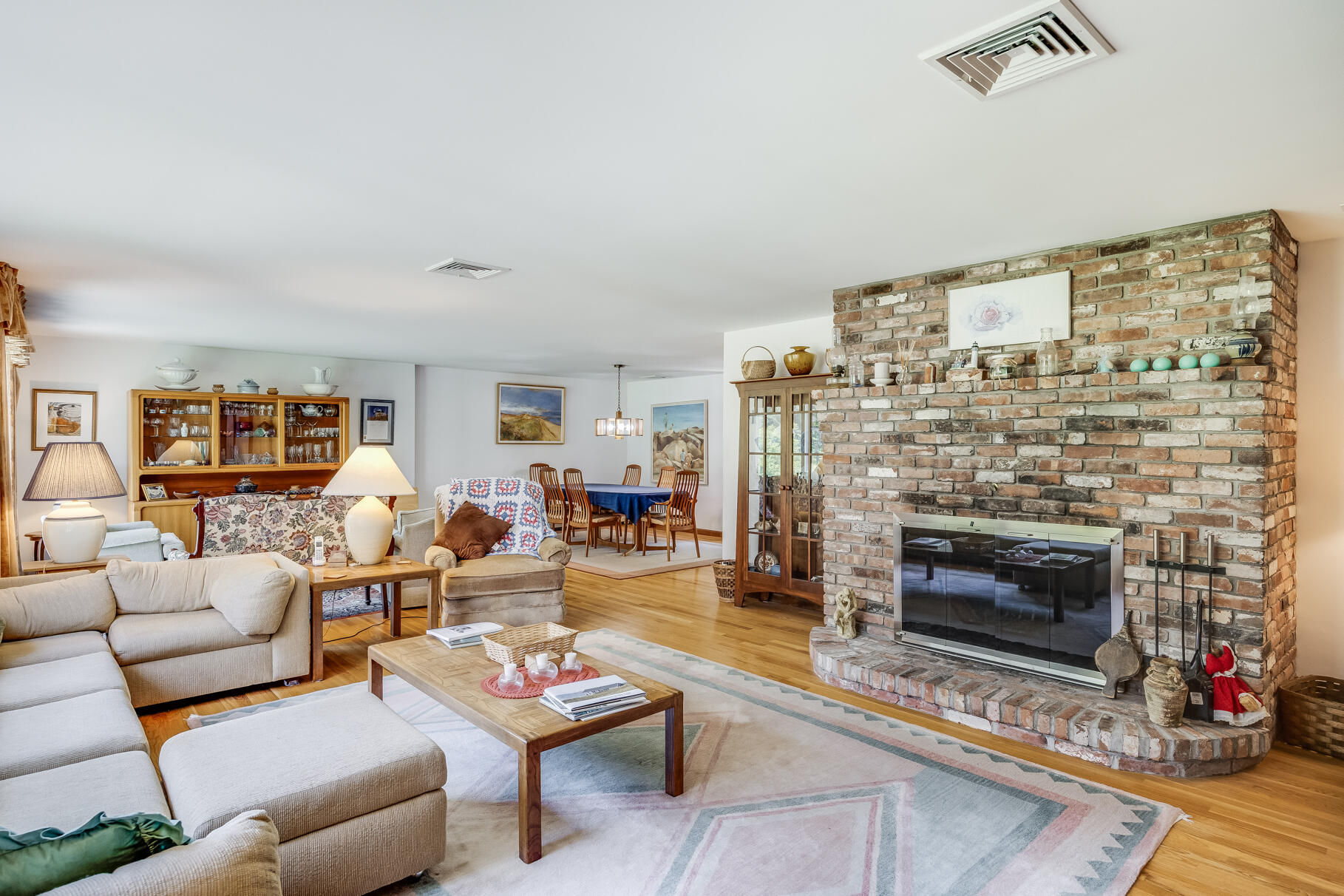 72 South Highland Road Truro, MA 02666 - Photo 10 of 59 a living room with furniture a fireplace and a flat screen tv