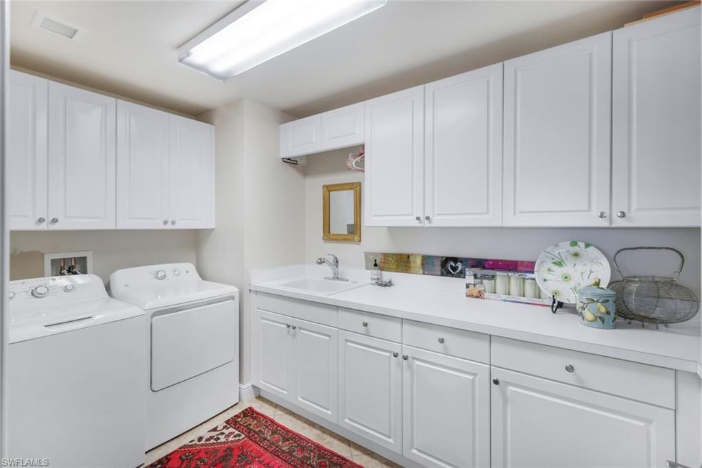 265 Indies Way, Unit 503 Naples, FL 34110 - Photo 12 of 45 Huge laundry with sink off the Kitchen. Can be used extra prep space.
