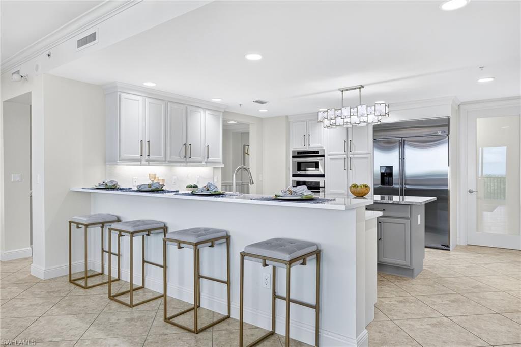 265 Indies Way, Unit 503 Naples, FL 34110 - Photo 7 of 45 Kitchen Breakfast Bar