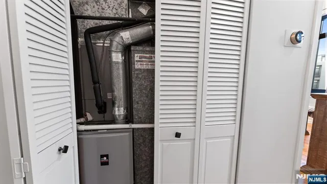 a kitchen with stainless steel appliances granite countertop a microwave a stove and refrigerator