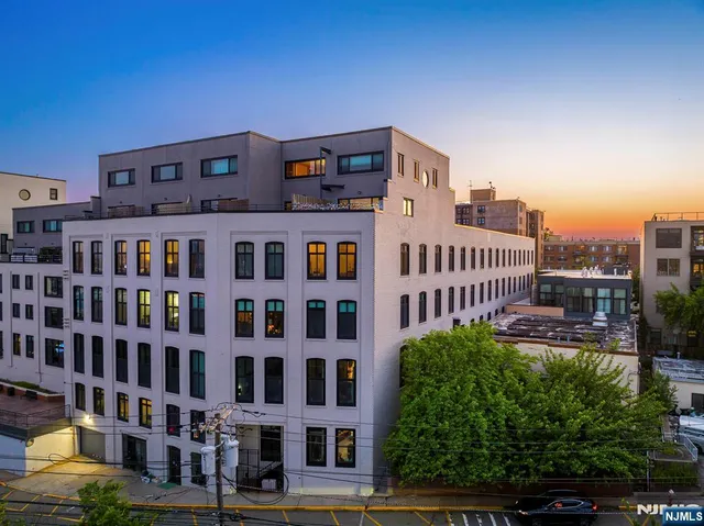 a view of a building with a garden