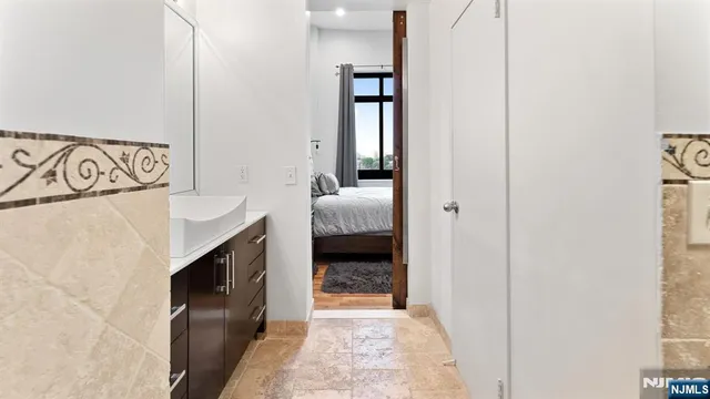 a en suite bathroom with a sink and a mirror