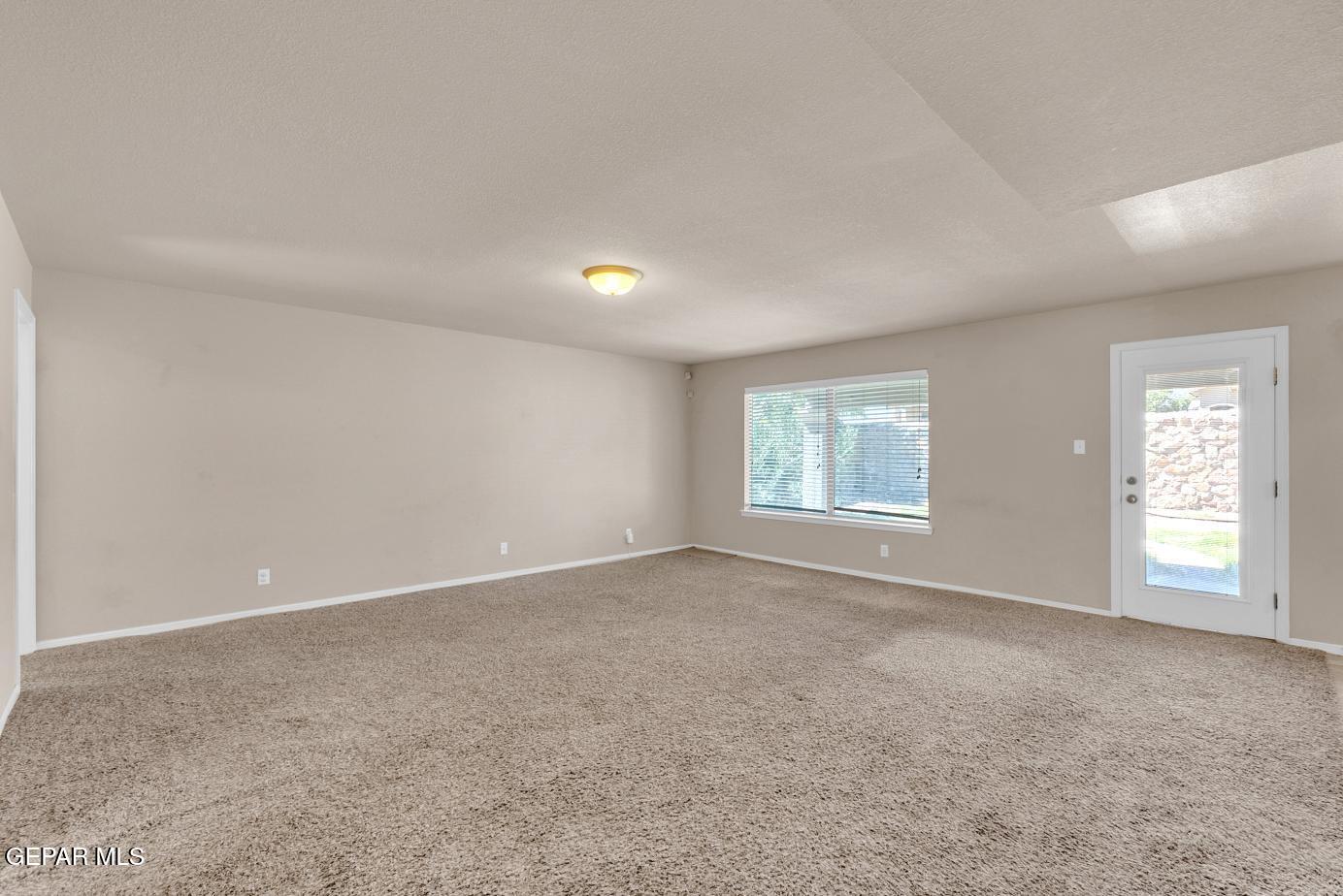 11349 West Ranch Court El Paso, TX 79934 - Photo 15 of 61 an empty room with windows