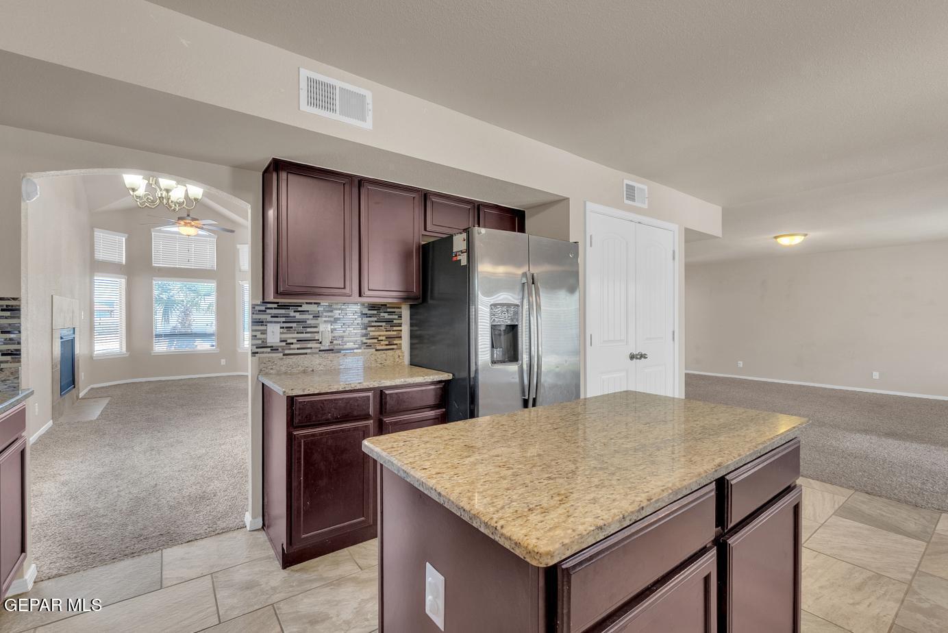 11349 West Ranch Court El Paso, TX 79934 - Photo 23 of 61 a kitchen with a table and chairs