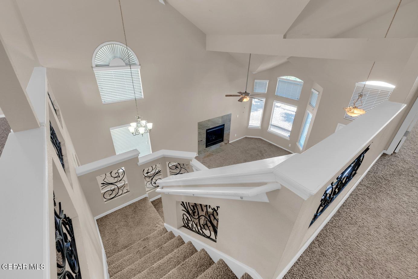 11349 West Ranch Court El Paso, TX 79934 - Photo 31 of 61 a living room with furniture and a chandelier