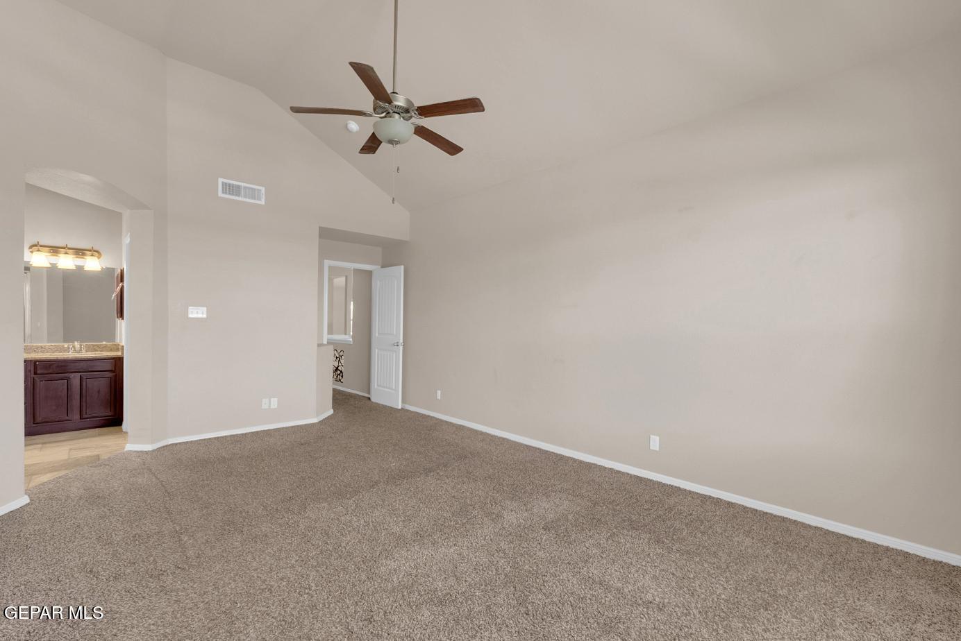 11349 West Ranch Court El Paso, TX 79934 - Photo 45 of 61 a view of a big room with a chandelier fan and windows