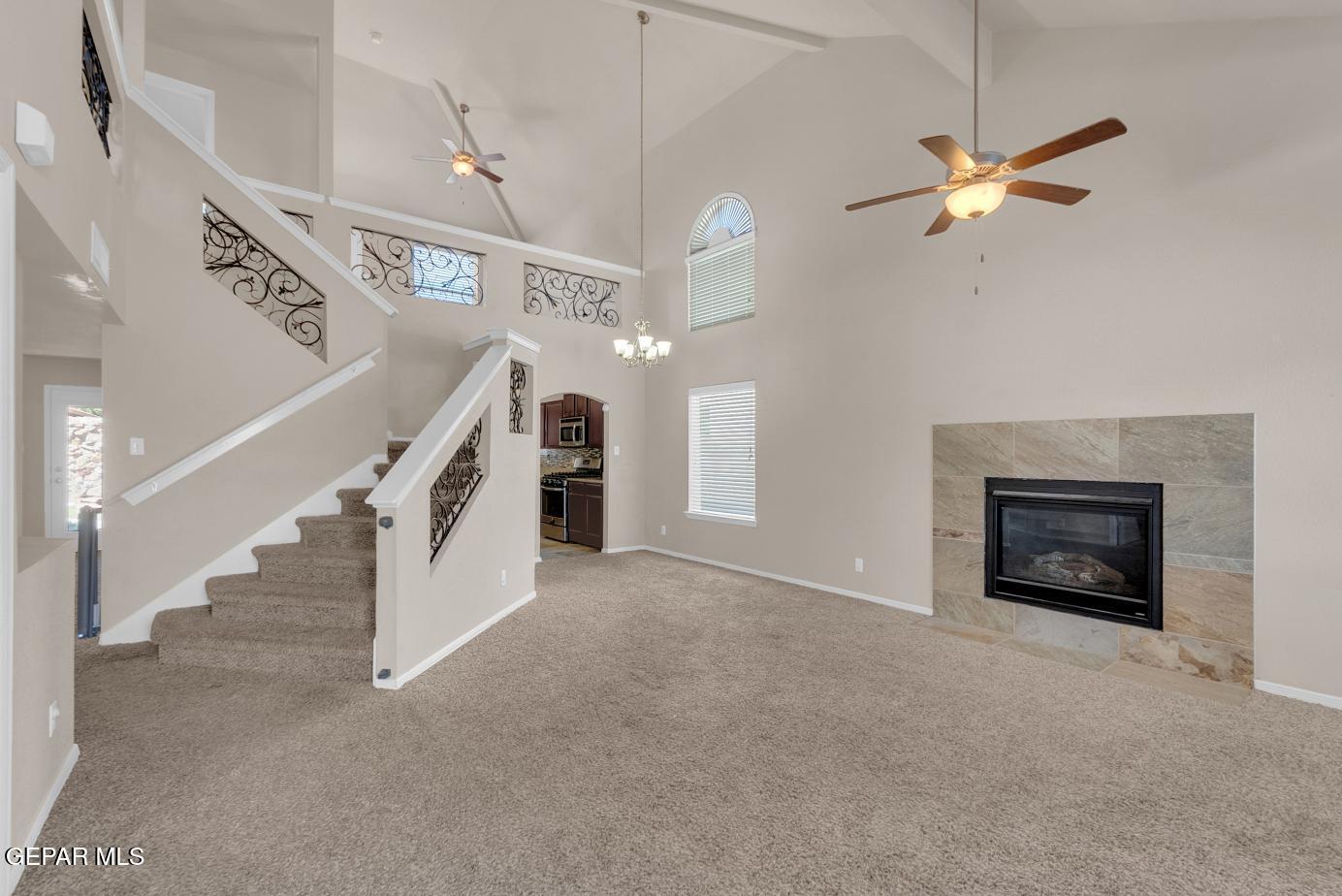 11349 West Ranch Court El Paso, TX 79934 - Photo 5 of 61 a view of a livingroom with a ceiling fan and staircase