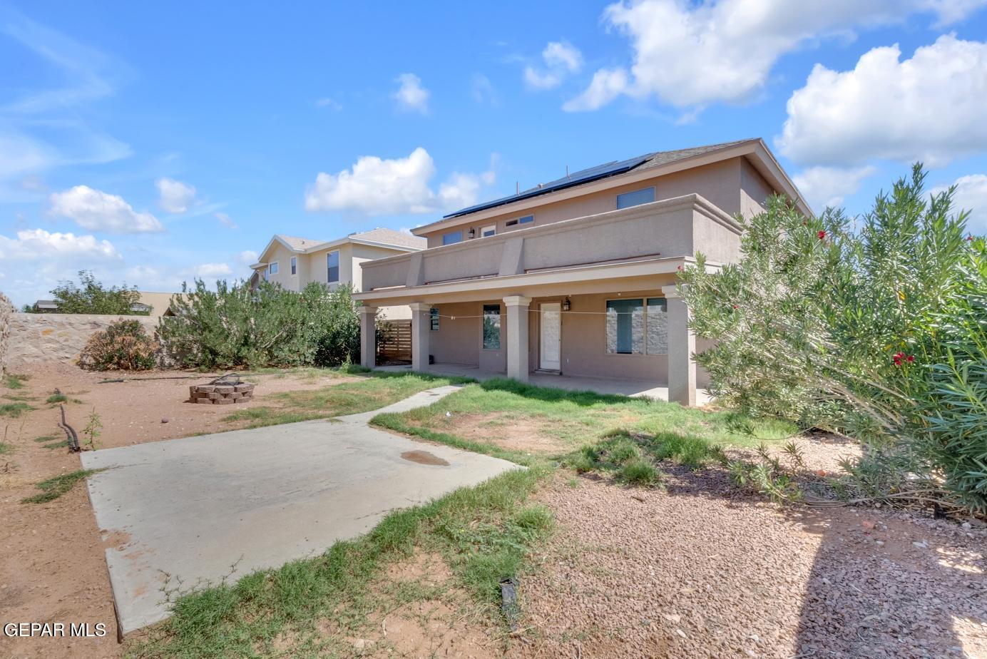 11349 West Ranch Court El Paso, TX 79934 - Photo 59 of 61 a view of a house with a yard and large tree