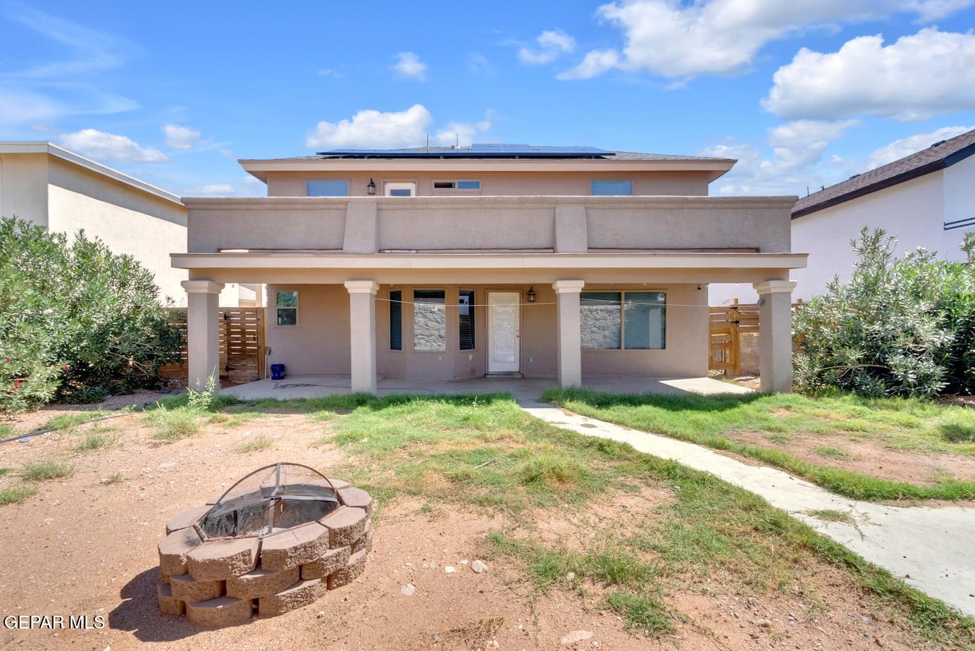 11349 West Ranch Court El Paso, TX 79934 - Photo 60 of 61 a backyard of a house with yard and outdoor seating
