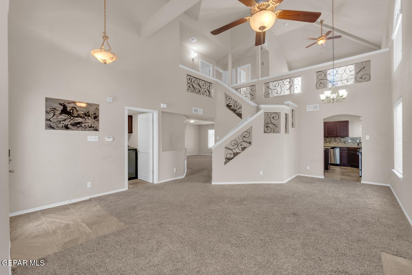 11349 West Ranch Court El Paso, TX 79934 - Photo 6 of 61 a view of an empty room with a ceiling fan and window