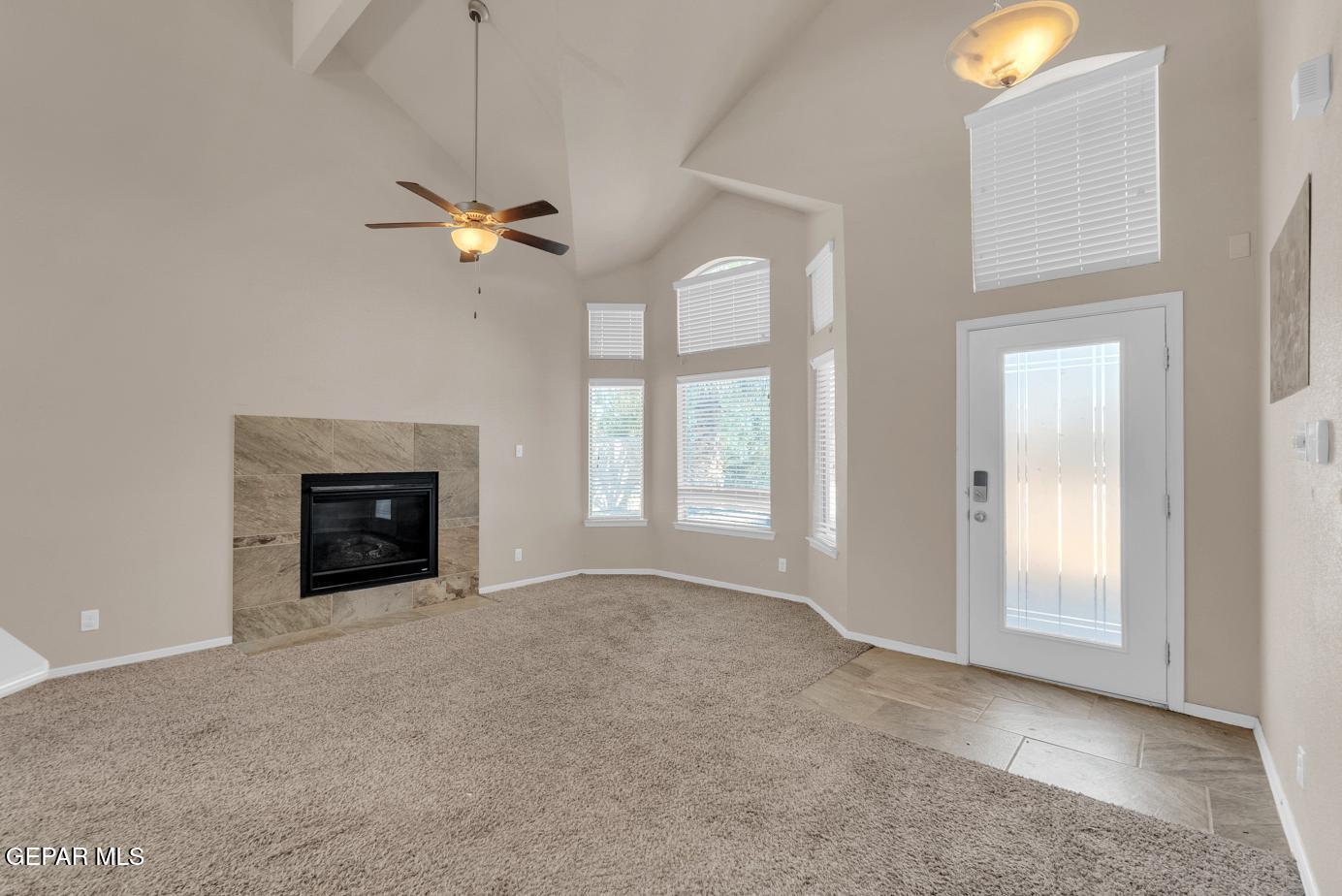 11349 West Ranch Court El Paso, TX 79934 - Photo 8 of 61 an empty room with windows and fireplace