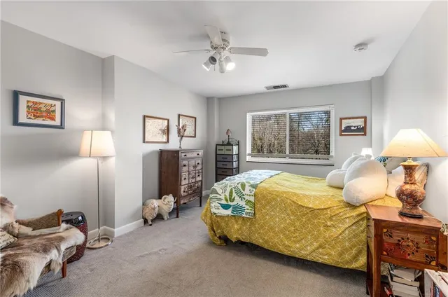 a bed room with a bed and window